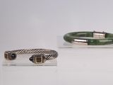 three different bracelets on display on a white surface