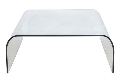 a clear glass coffee table with black metal legs