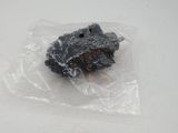 a stuffed animal in a plastic bag on a table