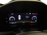 the dashboard of a car with a digital display on it
