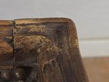 a close up of a piece of wood on the floor