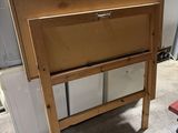 a wooden table with a drawer on top of it