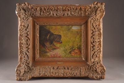 an old picture of a dog in a field with a mouse