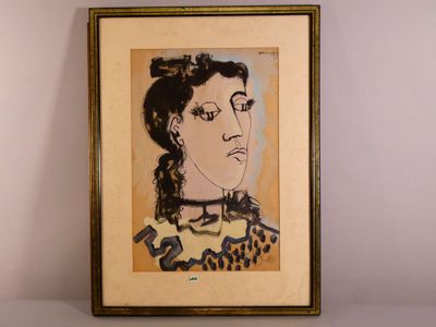 une image représentant un tableau représentant le visage d'une femme, dans un cadre doré