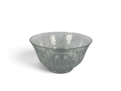 a glass bowl that is sitting on a white surface