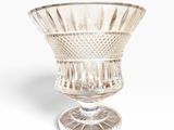 a glass bowl that is sitting on top of a table