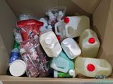 a cardboard box filled with various types of plastic bottles