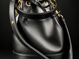 a black bucket bag on a black background