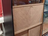 a display case with a glass door in the middle of it