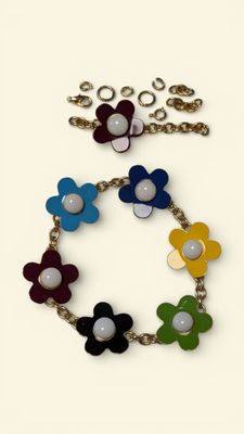 bracelet with multi colored flowers and pearls on a chain