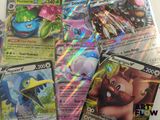 a lot of pokemon cards that are on the table