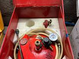 a red box with a hose in it and a hose in it