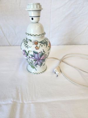 a lamp that is sitting on a table with a cord