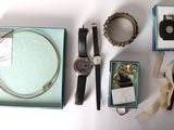 a box with a watch, a bracelet, a watch, a watch, a watch, a bracelet, a watch, a watch, a watch,