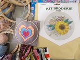 a picture of a cross stitch kit with a picture of a sunflower on it