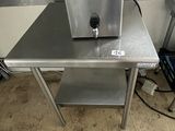 a small table that has a machine on top of it