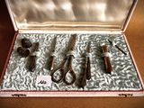 a box with a bunch of tools in it on a table