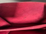 the inside of a red purse with a zipper on it