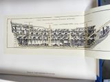 an open book with a drawing of a ship in it