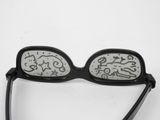 glasses with writing on them sitting on a white surface
