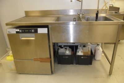 a stainless steel sink and a dishwasher in a kitchen