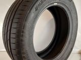 a close up of a tire on a white surface