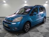 a picture of a blue van parked in a garage