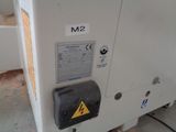 a machine that is sitting on the floor in the room