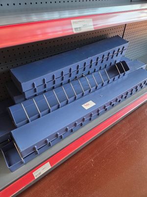 a shelf with a bunch of blue boxes on it