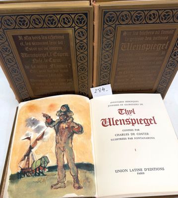 two books are open on a table with a picture of a man and a woman
