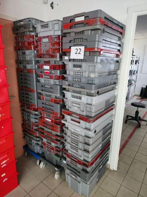 a large stack of boxes in the middle of a room
