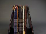 a stack of books sitting on top of each other on a table