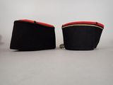 pair of black and red shoes with gold trims on them