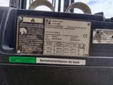 a close up of a parking meter with a sticker on it