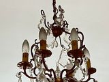 a chandelier hanging from the ceiling in a room