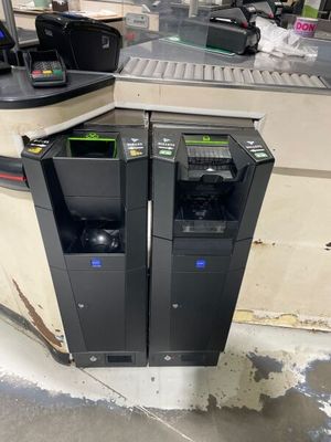 two trash bins sitting next to each other on the floor