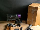 a box of vacuums and other household items on a table
