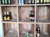 many bottles of beer on the shelves in the room