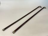 a pair of wooden sticks sitting on top of a white table