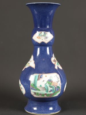a blue vase with a picture of a man and a woman on it