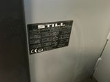 an image of a stainless steel refrigerator with the words still written on it