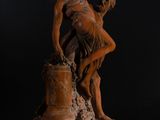 an image of a statue of a man and a woman on a pedestal
