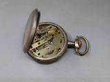an image of a silver pocket watch on a white surface