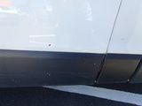 a close up of a car ' s door with a hole in it