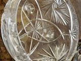 a glass bowl sitting on top of a piece of wood