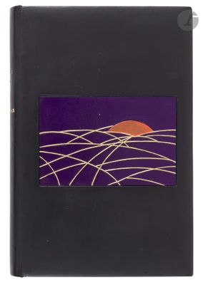 a black book with a picture of a sunset on it