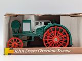 a box with a toy tractor in it on a white surface