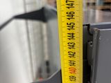 a measuring tape that is on the side of a machine
