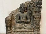 an image of a statue of a person sitting in a chair