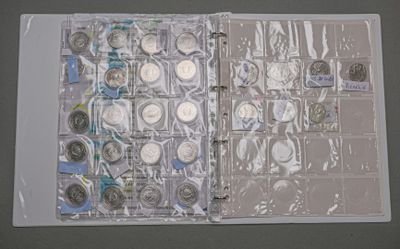 a picture of a book with a lot of coins inside of it